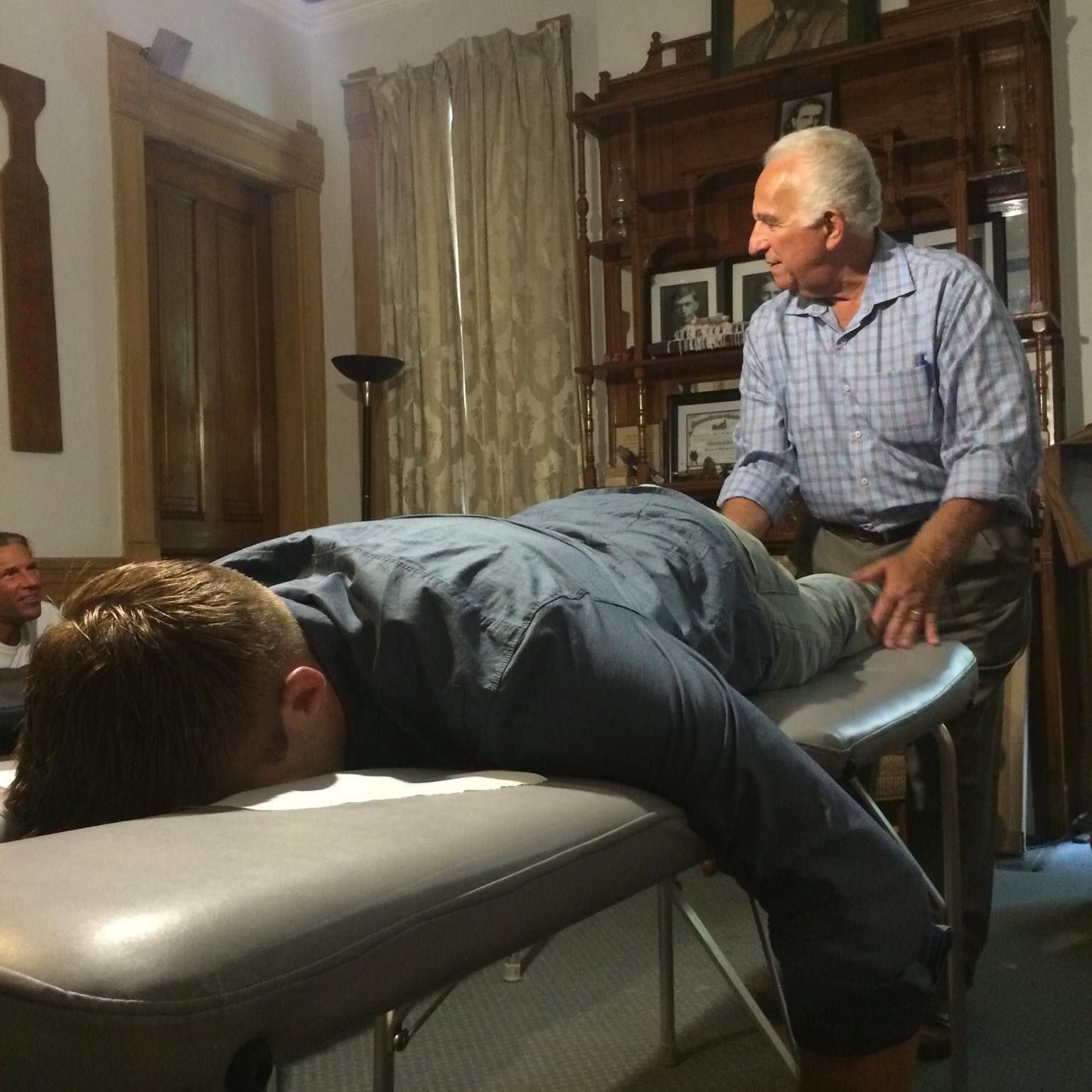 Dr. Talsky performing a tonal chiropractic adjustment